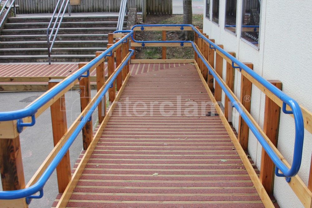 Compliant handrail built with Interclamp key clamp DDA Assist fittings installed at a school entrance, providing support and accessibility for everyone.